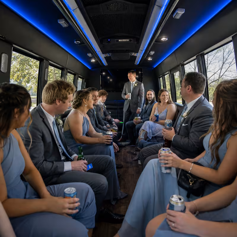 Wedding guests seated inside a Durham party bus