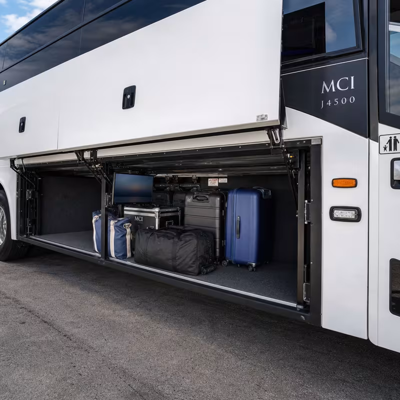 Party bus interior with wraparound leather seating and LED lighting in Durham