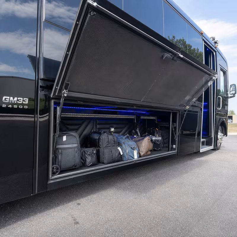 Party bus interior with wraparound leather seating and LED lighting in Durham