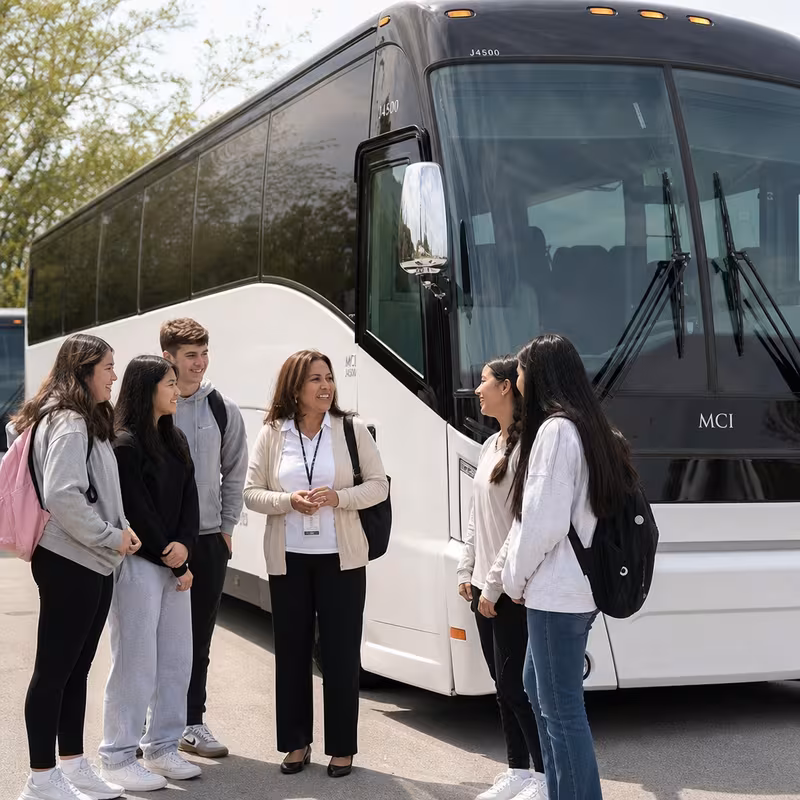 Passengers loading luggage while boarding an Durham group shuttle